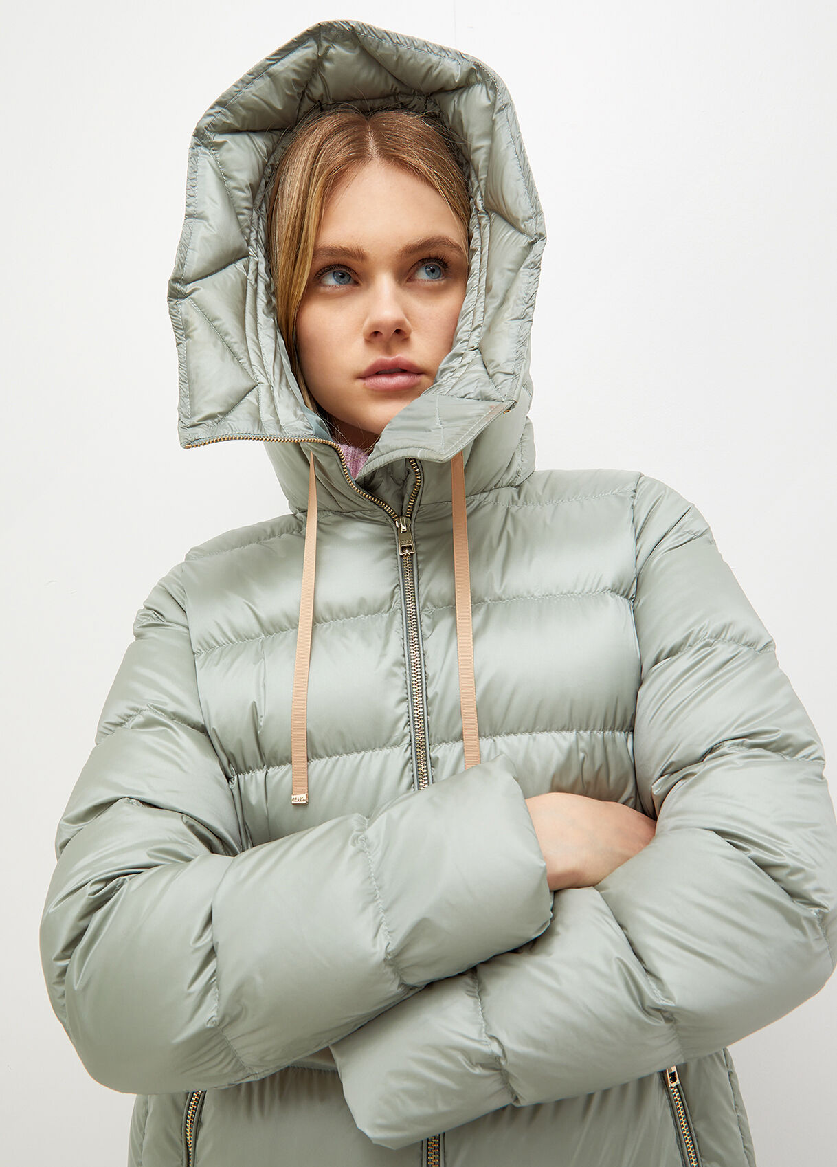 Down jacket in quilted technical fabric